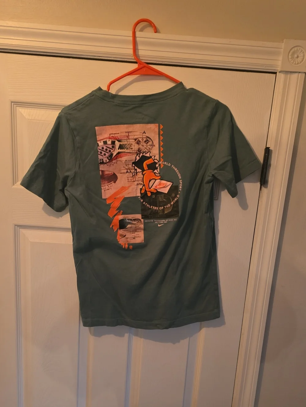 Nike Kids Green Graphic Tee with Orange Logo